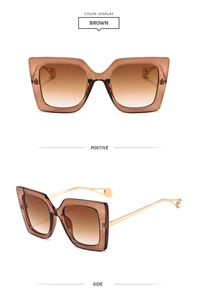 Detail of square gradient sunglasses with gold metal temples and pearl accents