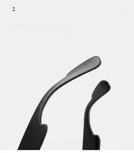Macro detail of glossy black curved temple legs for comfortable ergonomic fit