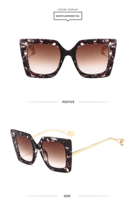 White leopard square sunglasses detail with pearl-decorated golden metal temples