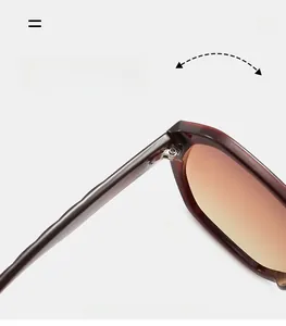 Detail of durable metal hinge on oversized sunglasses with tortoiseshell frame texture