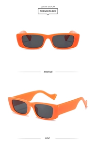 Détails de lunettes de soleil orange à monture épaisse avec verres foncés et branches ondulées