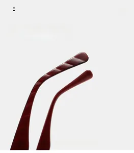 Detail of dark red acetate temple tips with curved design for comfortable sunglasses fit