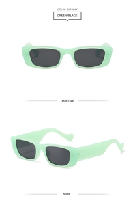Détail de lunettes de soleil vert menthe avec branches ondulées et verres sombres