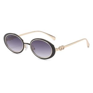 Lunettes de soleil ovales vintage, monture noire, branches dorées et verres dégradés violets