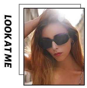 Outdoor model shot of chunky rectangular black sunglasses with wide geometric temples