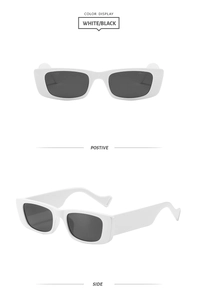 Détail de lunettes de soleil rectangulaires blanches à monture épaisse et verres foncés