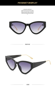 Vues de face et de côté de lunettes œil-de-chat noires avec branches dorées et verres gris