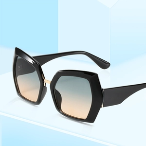 Oversized black hexagon sunglasses with blue orange gradient lenses and gold accents