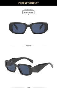 Detail view showing black thick-frame square sunglasses with wide geometric temples