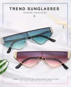 Detail of pilot sunglasses with gradient lenses and metallic diamond-quilted pattern accents