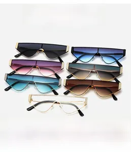 Detail view of multi-color fashion oversized sunglasses with golden metal mesh accents