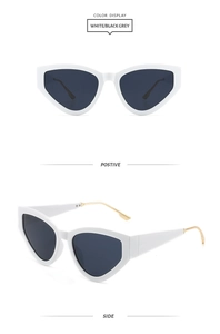 Détail de lunettes œil-de-chat blanches avec branches en métal doré et verres gris