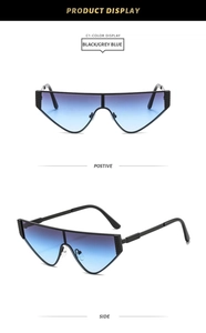 Detail of geometric cat-eye sunglasses with blue-purple gradient lenses and textured black arms