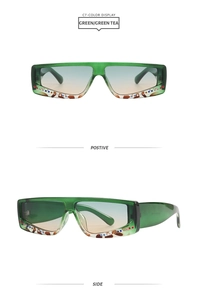 Detail view of square rhinestone sunglasses with green frames and gradient lenses