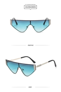 Detail of silver metal oversized cat-eye sunglasses with blue-green gradient lenses