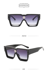 Detail of square oversized sunglasses with gradient lenses and star-shaped bridge decor