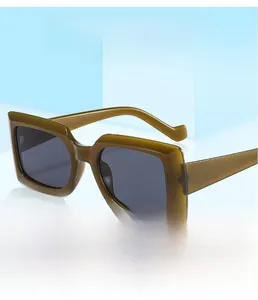 Detail of vintage square olive green resin frame with dark gray lenses for fashion sunglasses