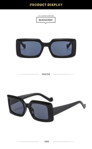 Front and 45-degree angle views of vintage black square sunglasses with gray lenses