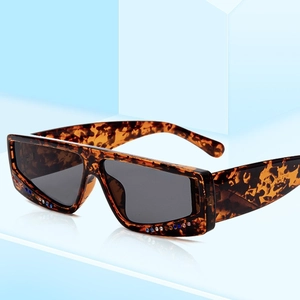 Tortoiseshell square oversized sunglasses with colorful rhinestones and dark lenses