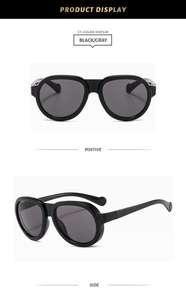 Front and side views of chunky black vintage sunglasses with grey lenses and round tips