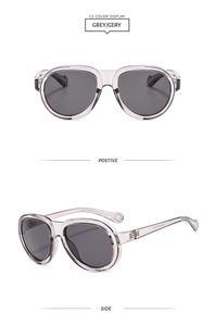 Detail view of grey semi-transparent pilot sunglasses showing front and side frames