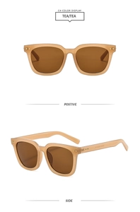 Detail view of tea-colored transparent sunglasses featuring gold dot rivets and 55-22-145 size
