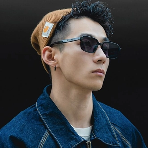 Minimalist square frame sunglasses for men with dark lenses in urban street style