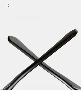 Detail of curved black mirror legs on sunglasses designed for ergonomic comfort and fit