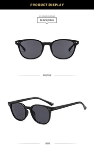 Close-up of black frame sunglasses with metal dots and deep gray lenses from two angles