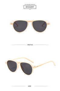 Detail view of retro beige pilot sunglasses with grey lenses and metal rivets