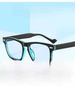 Detail of square black frame sunglasses with light blue lenses and silver diamond rivets