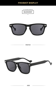 Macro shot of stylish black square frame sunglasses with silver metal rivets on the side