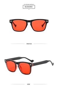 Front and side detail of square black frames with red lenses and silver rivets