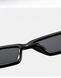Macro detail of glossy black rectangular frame sunglasses with high elastic material