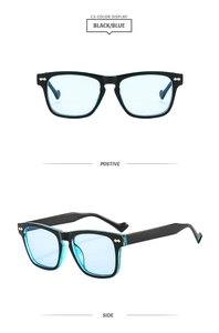 Detail of square black frame sunglasses with light blue lenses and silver rivets