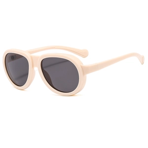Fashionable round frame sunglasses in beige for kids with dark grey sun protection lenses