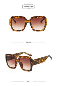 Détail de lunettes de soleil carrées léopard avec branches gravées et verres dégradés thé