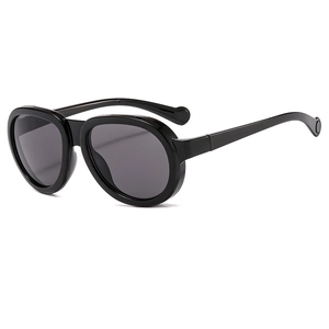 Fashionable black chunky square sunglasses with dark lenses for street style look