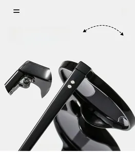 Detail of durable metal hinges on classic black retro sunglasses with silver stud accents