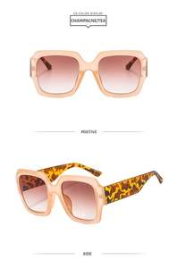 Détails de lunettes de soleil carrées champagne avec branches léopard et verres thé