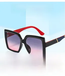 Detail of square sunglasses with gradient lenses and red-blue contrast temples