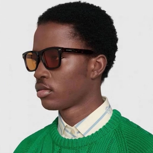 Fashionable men's tortoise square sunglasses with orange lenses shown on male model