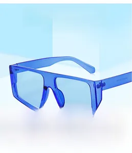Detail of stylish blue square frame sunglasses with transparent injection molded texture
