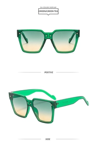 Détails de la monture verte transparente et verres dégradés de lunettes de soleil oversize