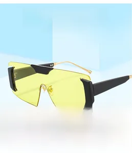 Detail of yellow frameless sunglasses featuring gold metal temples and modern accents
