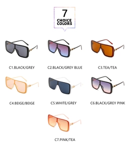 Matrix display of one-piece sunglasses in seven colors with golden hinge accents
