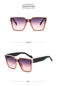 Détails de lunettes de soleil dégradé rose et rouge foncé avec accents dorés chic