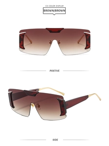Oversized rimless sunglasses with brown gradient lenses and gold metal temples detail
