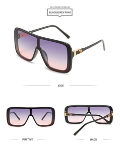 Detail view of oversized sunglasses with black frame and purple-pink gradient lenses