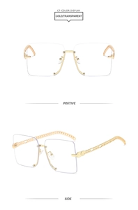 Detail of square rimless sunglasses featuring gold Cuban chain metal temples and clear lenses